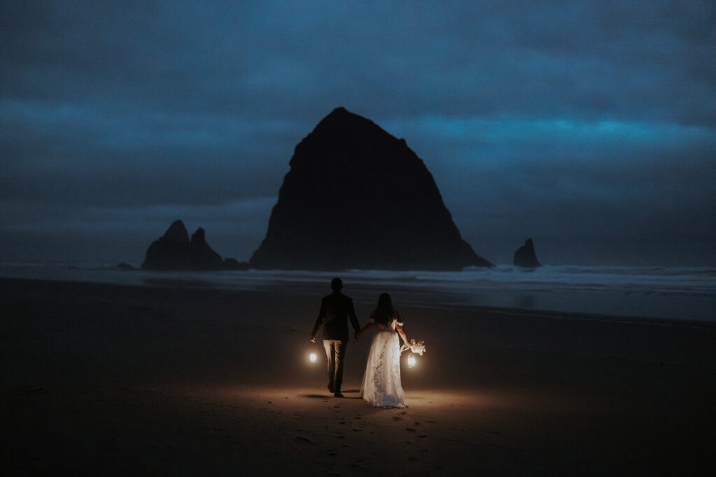 A non-traditional wedding couple had a unique elopement idea for a morning walk with lanterns at Cannon Beach.